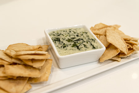 chips with dipper on white ceramic platter thumbnail
