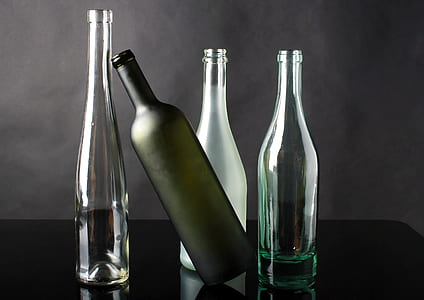 four clear glass bottles thumbnail