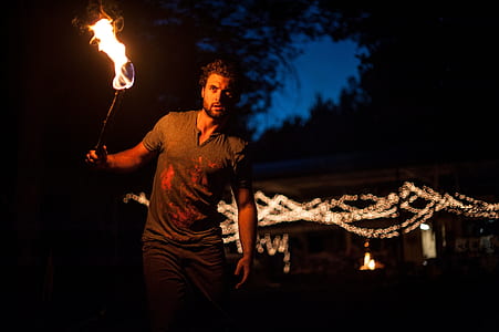 man holding torch thumbnail