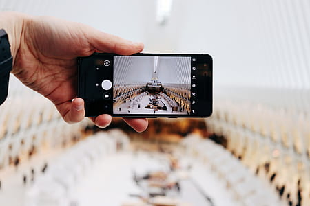 person holding iPhone 6 thumbnail