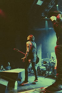 photo of rockstar holding electric guitar thumbnail
