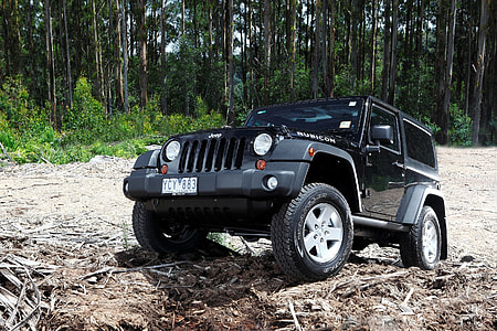 black Jeep Wrangler on off-road during daytime thumbnail