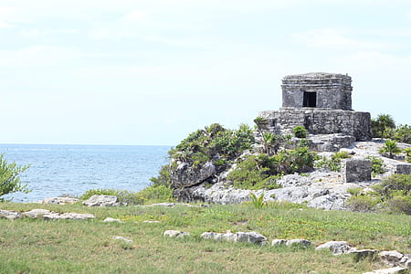 gray ruins near seashore at daytime thumbnail