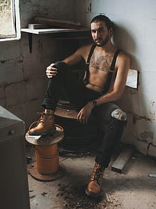 man wearing black pants and suspenders thumbnail