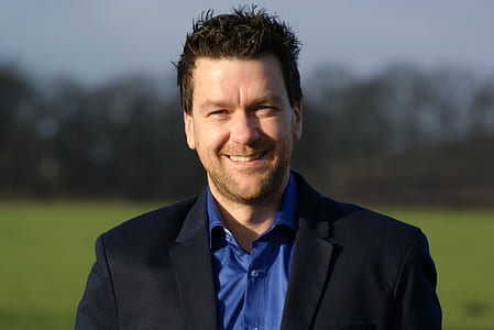 man smiling for photo thumbnail