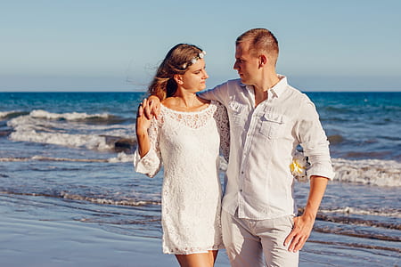 Couple Looking at Each Other Beside Beach thumbnail