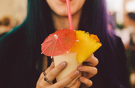 woman sipping on fresh fruit juice thumbnail