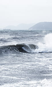 photography of ocean wave during daytime thumbnail