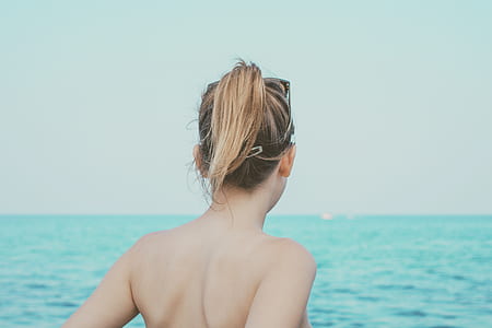 woman facing sea at daytime thumbnail