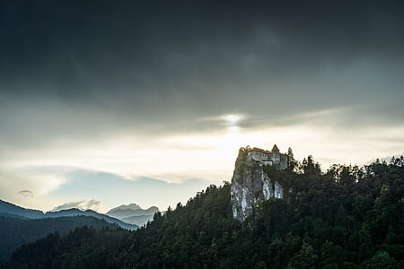 white castle on mountain peak thumbnail