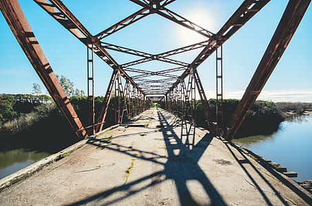 architectural photography of brown concrete footbridge thumbnail