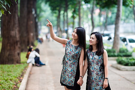 two woman holding hands thumbnail
