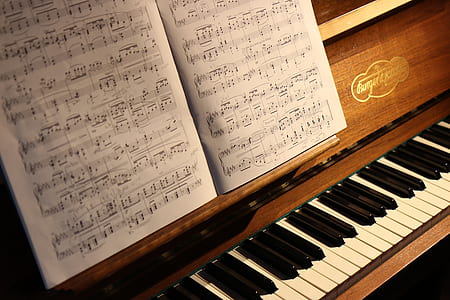 brown and white upright piano thumbnail