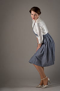 woman wearing white long-sleeved shirt and blue skirt thumbnail