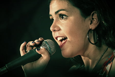 person holding black microphone thumbnail