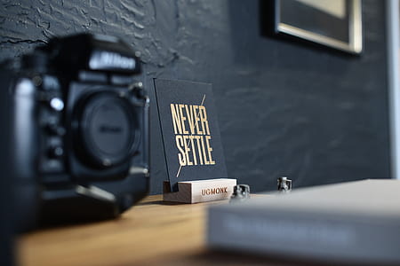 black Nikon DSLR camera thumbnail