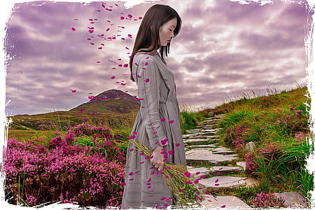 woman in gray long-sleeved dress near pink flowers thumbnail