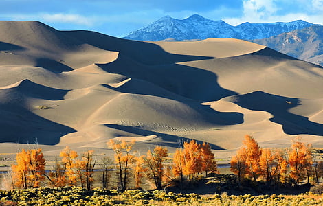 brown mountains under blue sky thumbnail