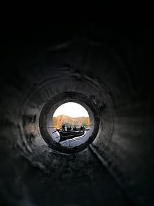 People Riding Canoe Boat View from Inside Pipe thumbnail