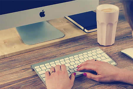 person using silver iMac thumbnail