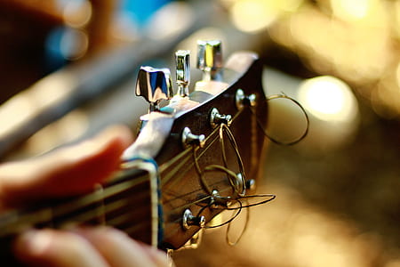 person holding acoustic guitar thumbnail