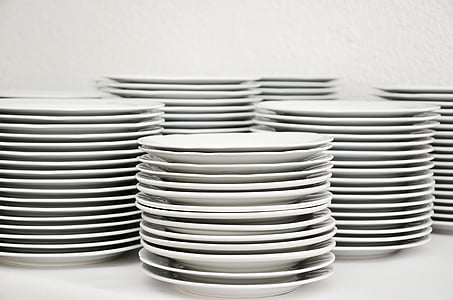 pile of white ceramic plates thumbnail