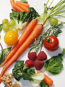 carrots, strawberries, tomatoes, and cabbage arrange on white textile thumbnail