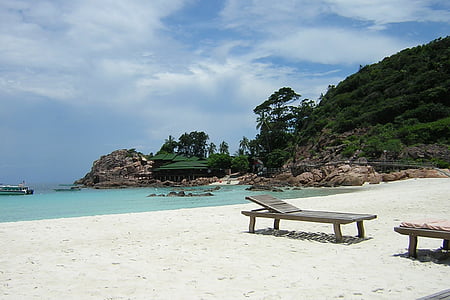 brown wooden lounger near body of water thumbnail