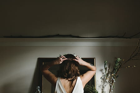 woman standing in front of mirror thumbnail