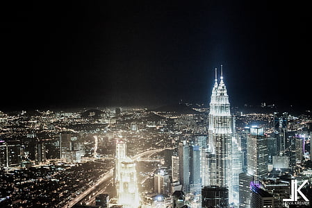 aerial view of lighted high-rise buildings thumbnail