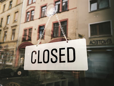 Closed signage on glass wall thumbnail