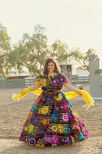woman wearing multicolored dress standing thumbnail