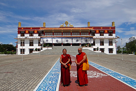 monks in-front of building thumbnail
