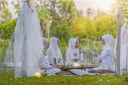 women having picnic on green grass thumbnail