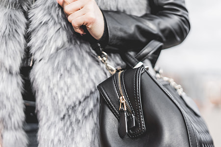 Woman Holding Her Black Leather Bag Close Up thumbnail