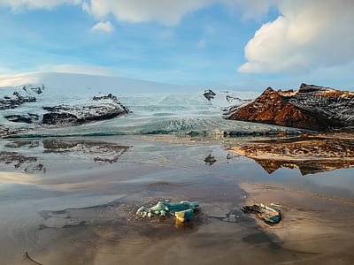 mountain surrounded by water at daytime thumbnail