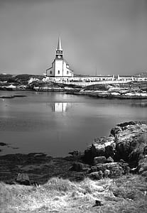 White Church Next to Body of Water thumbnail
