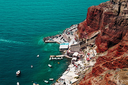 boats near seashore and houses thumbnail