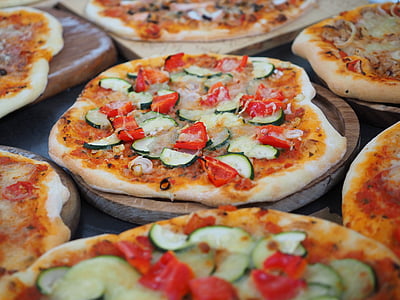 pizza on top of wooden plate thumbnail