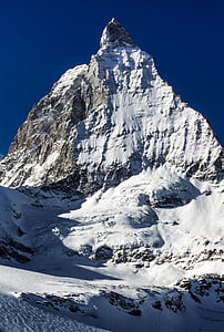 covered snow mountain under blue sky during daytime thumbnail
