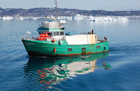 green and white ship on calm body of water at daytime thumbnail