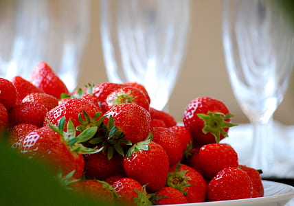 closeup photography of strawberries on white ceramic plates thumbnail