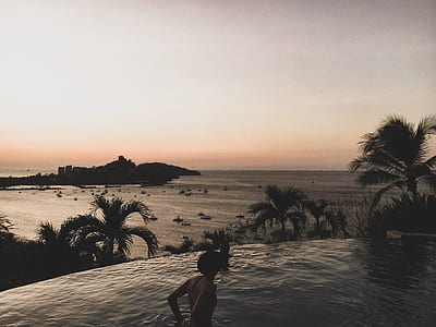 man in the pool at the resort thumbnail