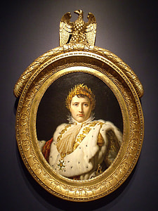 round gold-colored framed portrait of man wearing gold crown thumbnail