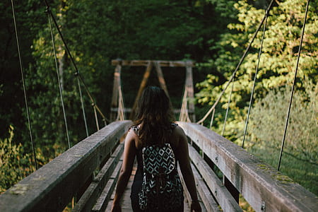 shallow focus photography of woman walking on thumbnail