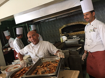 man in white chef's uniform smiling thumbnail