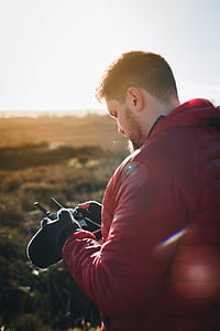 man using radio control at daytime thumbnail