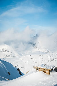 photo of snow-covered hills under clear blue sky thumbnail