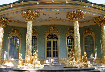 golden statue outside house during daytime thumbnail