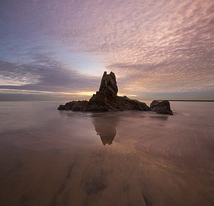 rock formation at the middle of the ocean thumbnail